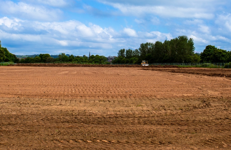 sports pitch being levelled